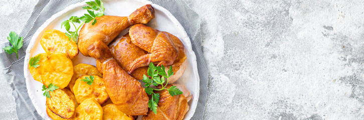 chicken pieces and potatoes fried , baked vegetable poultry meat organic dish on the table healthy food meal snack copy space food background rustic 