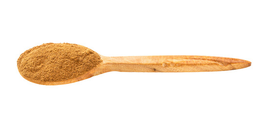 wooden spoon with cinnamon powder isolated