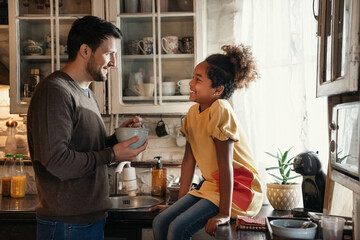 Father and daughter spending happy time at home. Single parent kid family love concept