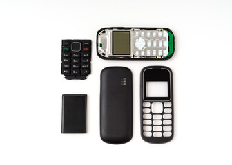 Old and outdated mobile phone set isolated on white background.