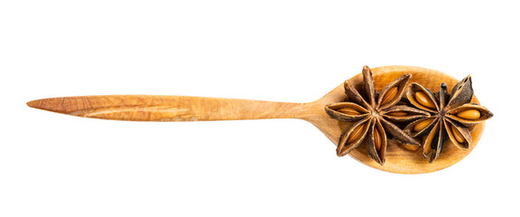 top view of wood spoon with star anise isolated