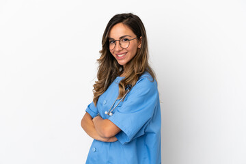 Young surgeon doctor woman over isolated white wall with arms crossed and looking forward