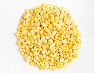 pile of raw moong dal (split green mung) beans