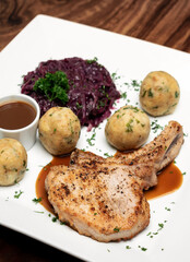 german style grilled pork chop with bread dumplings traditional meal