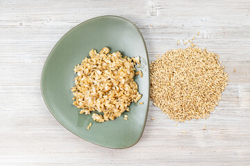 top view of whole oat grains and boiled porridge
