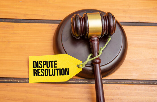 Dispute Resolution tag on wooden gavel