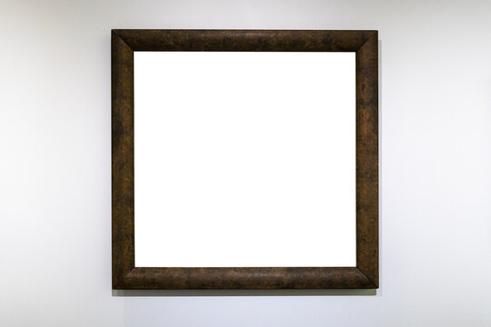 square dark brown picture frame on white wall