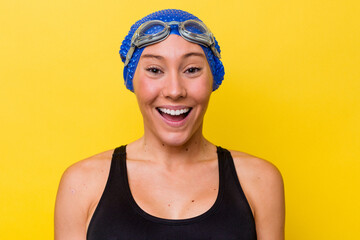 Young australian swimmer woman isolated on yellow background