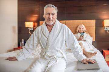 Couple in bath robes spending a day together and feeling relaxed