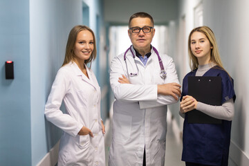 Doctors working in hospital and discussing over medical reports.