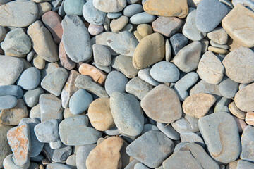 Background image of colorful pebbles on a beach 