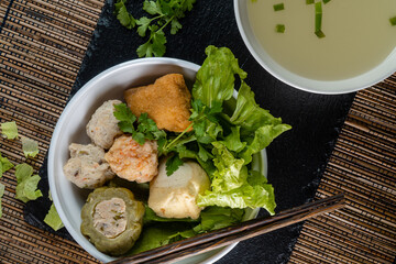 Yong tau foo , yong tau fu or Liong Tahu (In Indonesia). is a Hakka Chinese cuisine consisting primarily of tofu filled with ground meat mixture or fish paste.