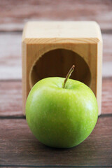 green apple fruit on a wooden background
