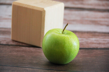 green apple fruit on a wooden background