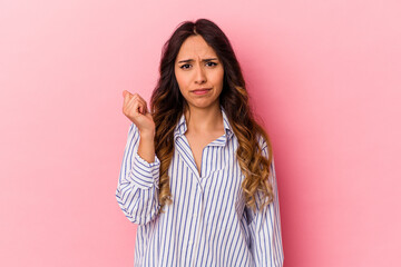 Young mexican woman isolated on pink background showing that she has no money.