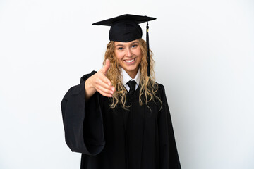 Young university graduate isolated on white background shaking hands for closing a good deal