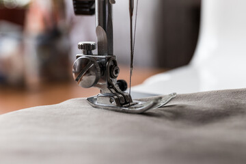 Production line sewing machine. Needle and footstep detail