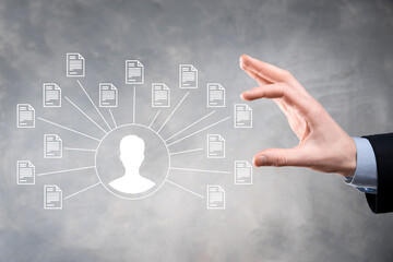Fototapeta premium Document Management System DMS .Businessman hold user and document icon.Software for archiving, searching and managing corporate files and information.Internet Technology Concept.Digital security.