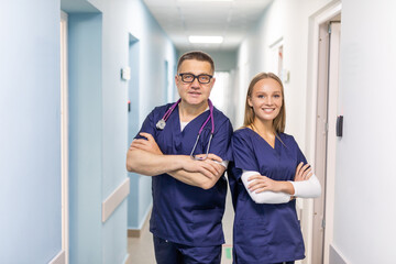 Fototapeta premium Two doctors discussing diagnosis while walking in hospital