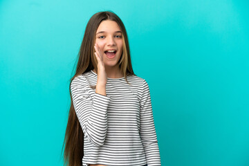 Little girl over isolated blue background shouting with mouth wide open