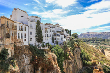 Obraz premium Beautiful and old city of Ronda , in South of Spain province of Malaga - Andalucía. The town is situated on two hills divided by a deep ravine containing the Grande River. Touristic travel destination