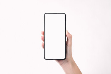 Woman hand holding the black smartphone with blank screen  isolated on white background