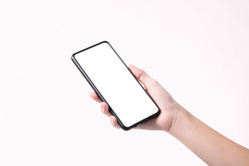 Woman hand holding the black smartphone with blank screen  isolated on white background