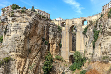 Beautiful city of Ronda situated in province of Malaga. View of the "Puente Nuevo" the newest and largest of three bridges that spanned the 120-metre-deep. Touristic travel destination in Andalucía