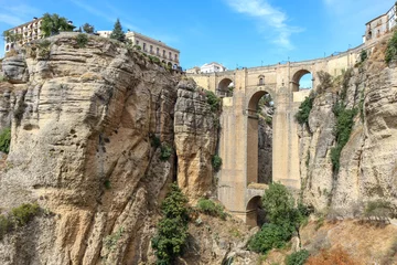 Ingelijste posters Ronda Puente Nuevo Beautiful city of Ronda situated in province of Malaga. View of the "Puente Nuevo" the newest and largest of three bridges that spanned the 120-metre-deep. Touristic travel destination in Andalucía  © alexemarcel