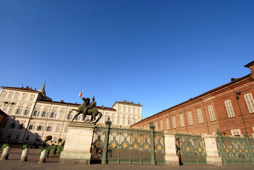 Fototapeta premium gate of the Royal Palace, statues of the Dioscuri, church and dome of San Lorenzo and Palazzo Reale in Piazza Castello.