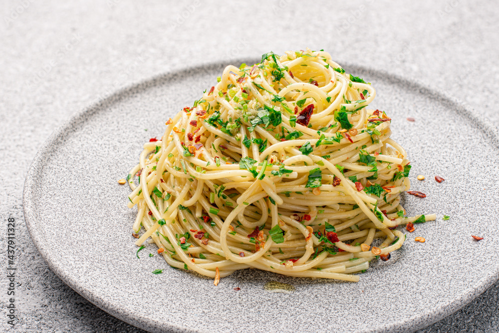 Wall mural plate with cooked classic italian spaghetti aglio olio