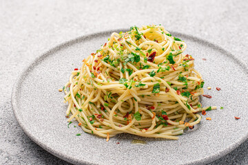 Plate with cooked classic Italian spaghetti aglio olio