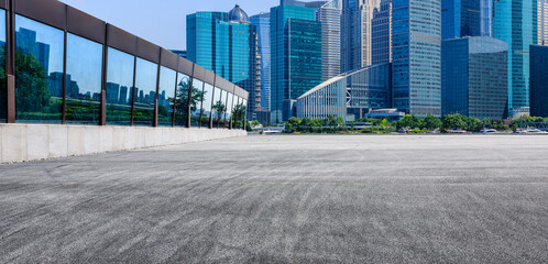 Wide asphalt road pavement and modern urban architecture in Shanghai,China.