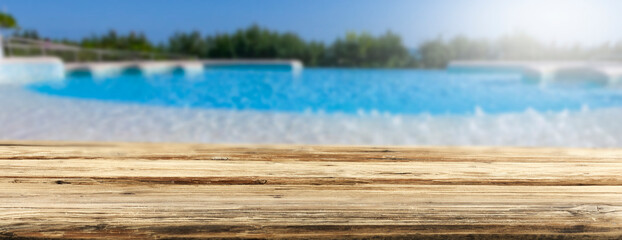 A wooden table on a beautiful sunny holiday day with a charming sea landscape 