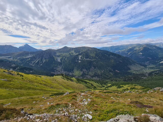Fototapeta premium Natural landscape with blue sky and green mountains.
