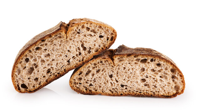 Slices of freshly baked homemade sour dough bread isolated on white background.