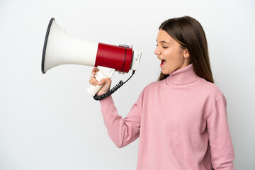 Little girl over isolated white background shouting through a megaphone to announce something in...