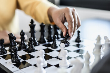 Two business women competitors playing chess board game, business competition concept, business plan to be the number one company, competitor analysis and problem solving. For always good results.