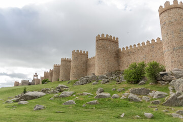 Fototapeta na wymiar Majestic view of Avila city Walls & fortress, full around view at the medieval historic city