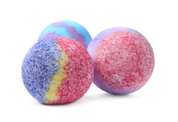 Three colorful bath bombs on white background