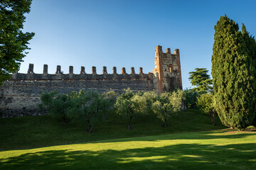 Fototapeta na wymiar Medieval surrounding wall of the small village of Lazise, tourist resort on the coast of Lake Garda (Lago di Garda). Verona province, Veneto, Italy, southern Europe.