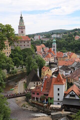Fototapeta premium Beautiful view of river, castle and city center with green trees - Cesky Krumlov, Czech republic, Europe