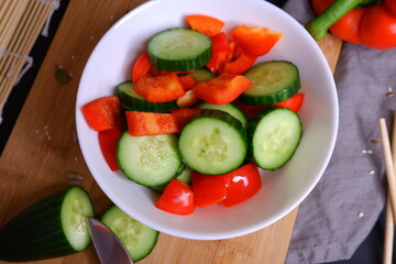 Vegetable salad in a white plate.