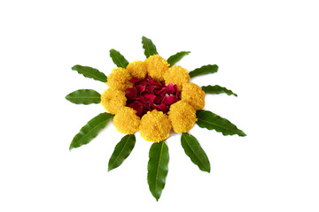 Flower rangoli for Diwali or Pongal made using marigold or zendu flowers and red rose petals over white background