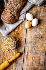 bakery concept with homemade bread on rustic background top view moke-up