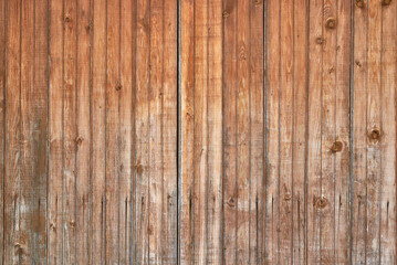 Brown wooden background made of planks. Old fence.