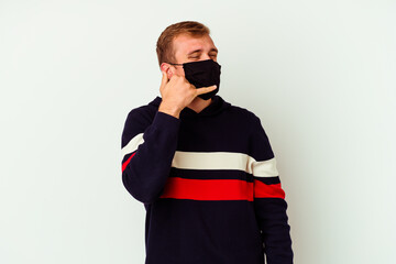 Young caucasian man wearing a mask for virus isolated on white background