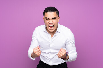 Asian handsome man isolated on blue background frustrated by a bad situation