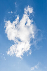 White clouds on the blue sky perfect for the background. Clear blue sky and white clouds. Blue sky background with clouds.
