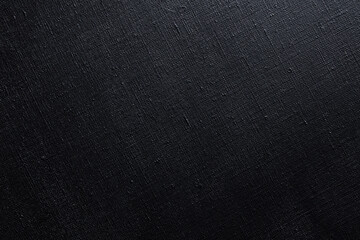 Fototapeta premium dark creative background: black primed linen canvas, uneven lighting, color toning